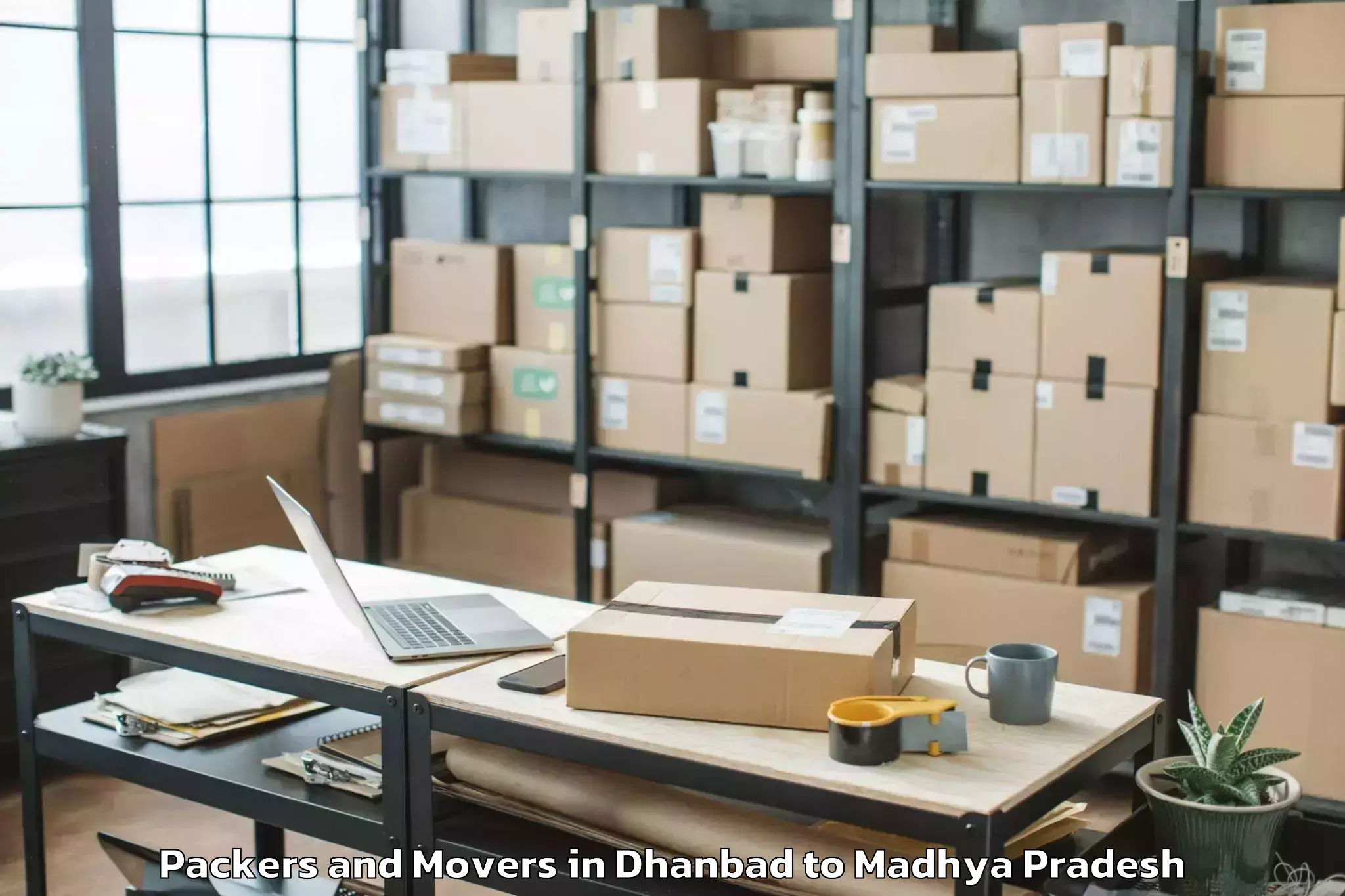 Reliable Dhanbad to Kukshi Packers And Movers